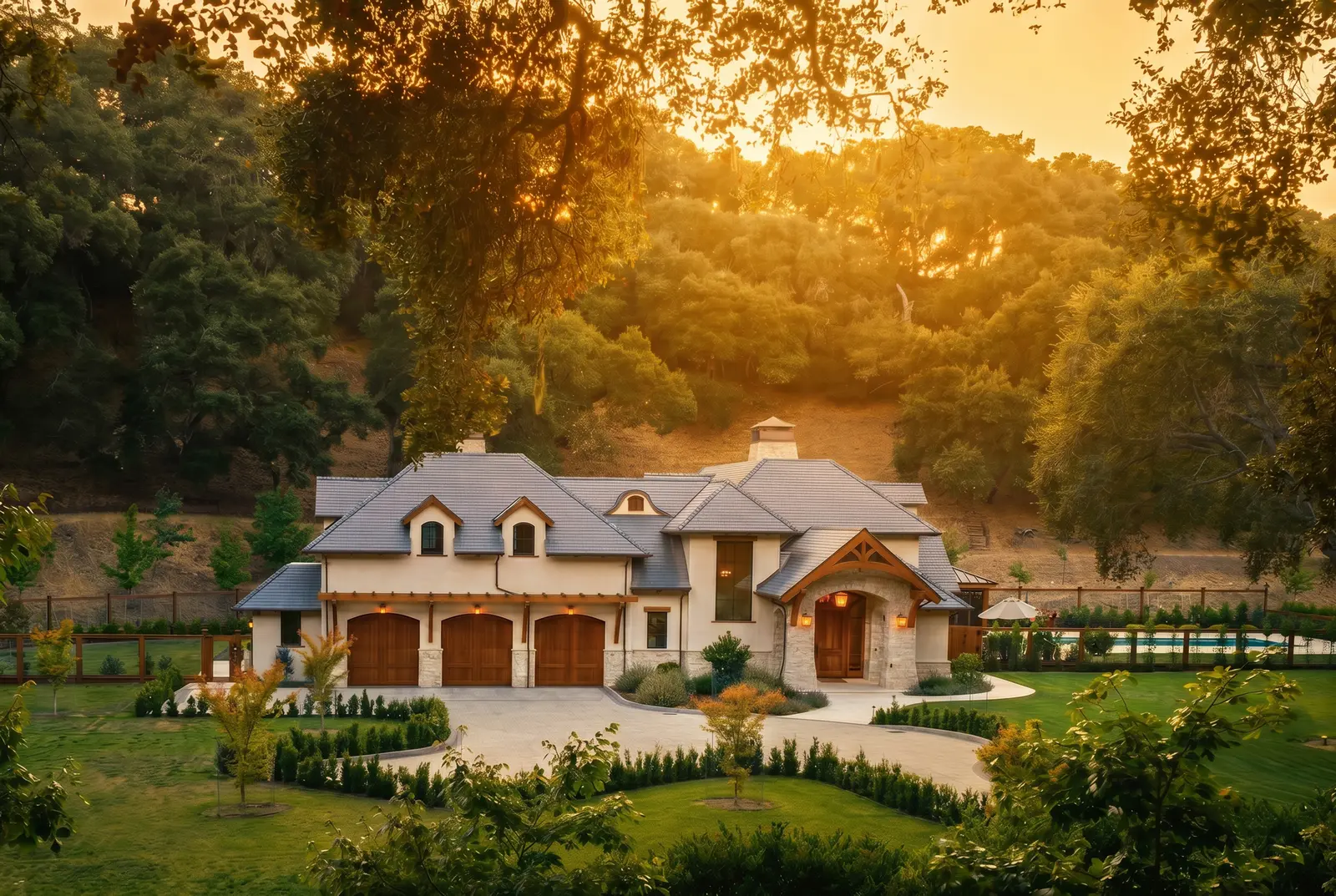 Country estate at golden hour with warm light through the trees — architectural photography by Manny Espinoza