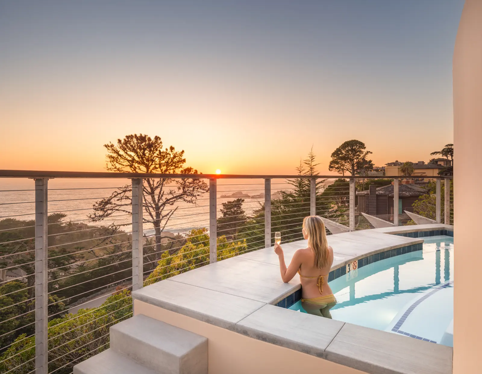 Infinity pool overlooking the ocean — lifestyle real estate photography