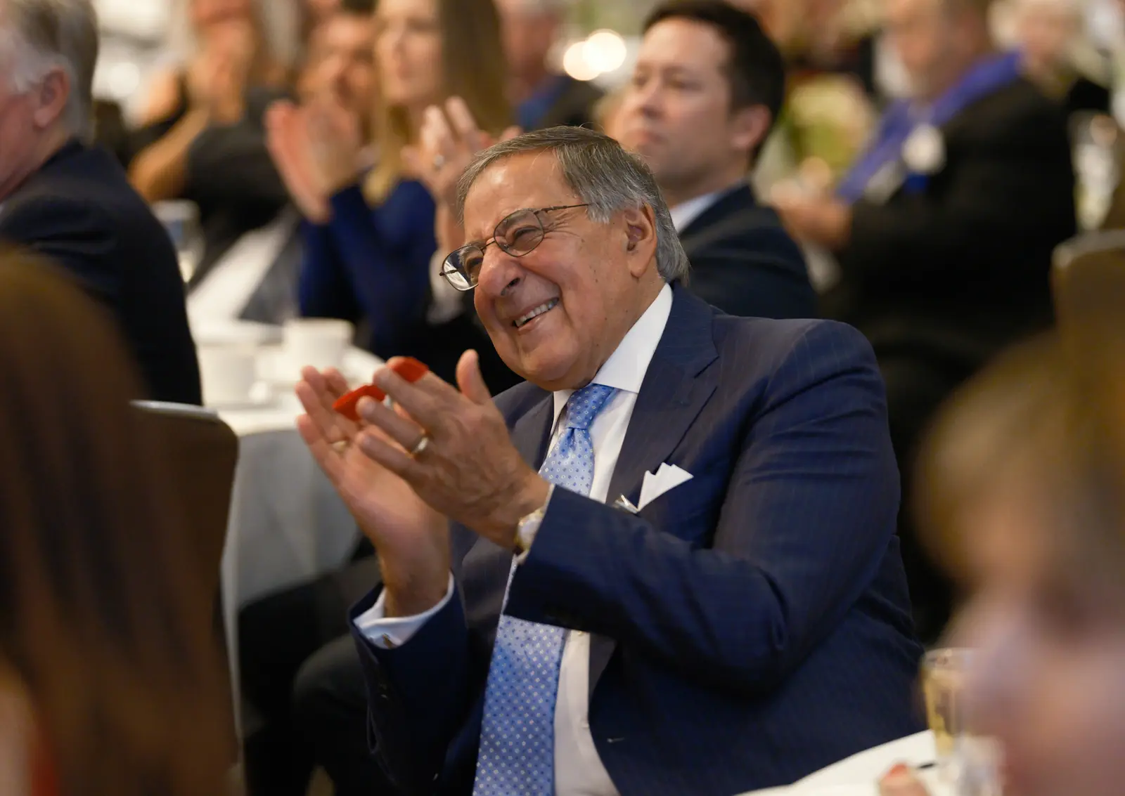 Leon Panetta applauding at a Monterey Peninsula event, photographed by Manny Espinoza